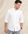 This basic white woven shirt from Tommy Hilfiger gets a sleek modern upgrade with a slim fit that updates your casual style.