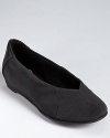 A small internal wedge gives subtle lift to a classic pair of Eileen Fisher flats.