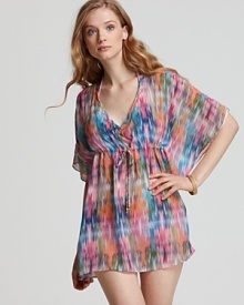 Take your love of prints poolside with this printed tunic from PilyQ. With a drawstring waist and floaty sleeves, this cover up lends a bohemian vibe to your sunbathing routine.