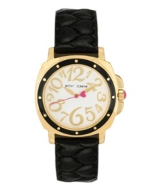 A little old-fashioned and a little over-the-top. Watch by Betsey Johnson crafted of black quilted leather strap and round polished gold tone stainless steel case with black bezel. White dial features whimsical gold tone numerals, gold tone hour and minute hands, pink second hand with heart and logo. Quartz movement. Water resistant to 30 meters. Two-year limited warranty.