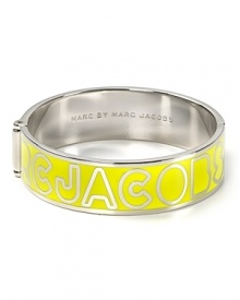 MARC BY MARC JACOBS' enamel bangle has designer appeal. Emblazoned with the label's logo, this simple silvery bracelet has fashion forward written all over it.