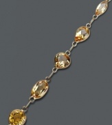 Warm up your look in sunshine-inspired color. This glowing bracelet highlights round and oval-cut citrine (6 ct. t.w.) in a rich 14k gold setting. Approximate length: 7 inches.