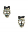 Tough yet tender. A skull motif may have an eerie effect, but Betsey Johnson's stud earrings offer a fun, feminine twist with glittering multicolored crystals, heart-shaped eye details and a bow accent. Crafted in mixed metal. Approximate diameter: 4/10 inch.