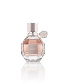 FLOWERBOMB is a floral explosion, a profusion of flowers that has the power to make everything seem more positive. Opulent and full-bodied, the iconic and multi-faceted Viktor & Rolf Flowerbomb bottle is now available in a luxurious, refillable version with a precious pink metallic seal and screw-top cap. Let the magic of Viktor & Rolf live on with the Eau de Parfum Refill to recharge your refillable bottle.