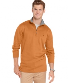 Do yourself a solid and toss on the cool, casual polish of this solid ribbed quarter-zip sweater from Izod. (Clearance)