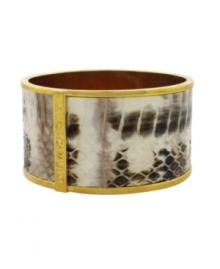 Exotic elegance. Reptile embossing adds a dramatic decorative detail to this bangle bracelet from Vince Camuto. Crafted in gold tone mixed metal. Approximate diameter: 2-1/2 inches.