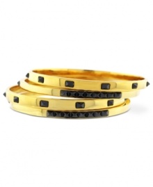 Vince Camuto's trendy 4-bangle set features golden shine mixed with hematite-hued details. Crafted in gold tone mixed metal. Approximate diameter: 2-1/2 inches.