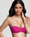 The rich cerise hue of this Zimmermann bikini top is the perfect compliment to a sought-after summer tan.