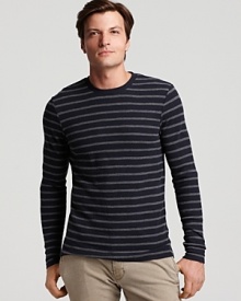 Narrow tonal stripes and sleek silhouette make this crewneck sweater a stand-out from Vince.