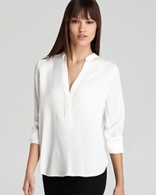 Articulated in luxe stretch silk, this airy Vince top transitions from season to season with effortless chic.