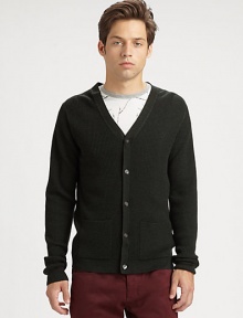 A classic waffle-knit cardigan made from impeccable virgin wool and featuring convenient patch pockets.V-neckLong sleevesElbow-patch detailsButton frontPatch pocketsVirgin woolDry cleanImported