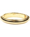 A simple, subtle addition for instant style. AK Anne Klein's textured stretch bracelet slips effortlessly over the wrist. Crafted in gold-plated mixed metal. Approximate diameter: 2-1/4 inches.