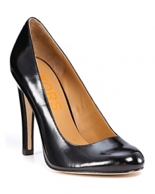 Add a little sparkle to any ensemble in glitter patent leather pumps from KORS Michael Kors. A must-have for the season!