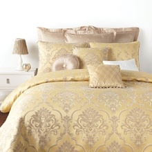 Splendid tradition: this Waterford bedskirt flaunts a finely woven classic damask design in shades of ivory and taupe on a golden straw sateen ground. The reverse boasts a woven jacquard scroll pattern, trimmed with fancy multicolor twist cord.