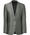 Elegant jacket in fine, grey wool and cotton blend - Fabric has a subtle sheen - Single-breasted style with two-button closure and deep, narrow-cut lapels - Chest pocket and flap pockets at sides - Straight, slightly longer cut through the torso - Polished and classically cool, seamlessly transitions from day to evening - Pair with a button down and slim trousers or chinos