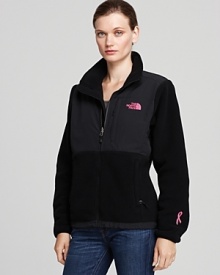 This The North Face® jacket boasts signature abrasion-reinforced shoulders and chest--perfect for keeping active in winter weather. This special style flaunts a pink chest logo and a pink ribbon at the cuff for breast cancer awareness.