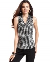 A houndstooth print gives this cowlneck blouse from Alfani graphic appeal.