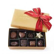 This 8 piece holiday gift box of Godiva chocolate includes an assortment of milk, dark and white chocolates with a variety of praline, fruit, nut and caramel fillings. Adorned with a beautiful Bloomingdale's bow.