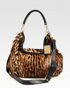 Luxurious animal print haircalf accented with supple leather in a chic slouchy design.Leather top handle, 9½ dropDetachable adjustable leather shoulder strap, 21½-22½ dropMagnetic top closureOne inside zip pocketTwo inside open pocketsSatin lining20W X 17H X 5DMade in Italy