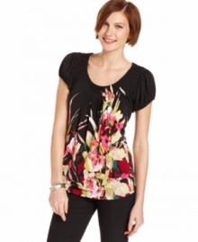 Style&co.'s top has pretty features like a bright floral print and pleating at the neckline. So easy to pair with everything from cropped skinny pants to jeans!