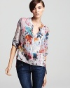 An artful watercolor print enriches your spring with vibrant color on this BCBGMAXAZRIA silk top, an chic choice for easy weekends which style is on the agenda.