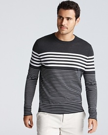 Variegated stripes and a solid shoulder panel bring a minimalist-modern appeal to Vince's lightweight cotton sweater.