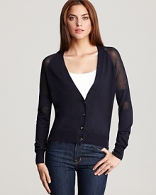 A MARC BY MARC JACOBS cardigan boasts semi-sheer stripes at the sleeves and back for a unique twist on the essential style. Layered over a tank with skinny jeans, the look is perfect for a polished weekend.