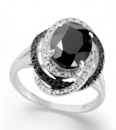 Mysterious brilliance. A stunning oval-cut onyx (8mm x 10mm) makes a captivating focal point in this formal ring amidst swirled bands of white diamonds (1/10 ct. t.w.) and black diamonds (1/10 ct. t.w.). Ring set in sterling silver. Size 7.