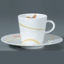 For over two centuries Raynaud has created unique Limoges porcelain, with a marked preference for relief shapes and generously colored and gilt decorations. Metamorphoses is a striking pattern of red and gold with a butterfly motif.