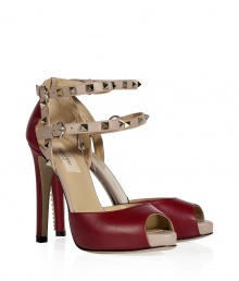 Finish your look with a note of hard-edge elegance in Valentinos deep red and powder peep-toe pumps, complete with iconic rockstud trim - Double buckled ankle straps - Pair with sharply tailored separates or chic cocktail dresses