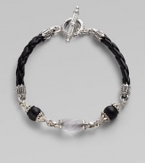 From the Iris Collection. From the carved frosted rock crystal bead to the smooth matte onyx beads and braided leather cord, this piece is a study in understated elegance. Sterling silver Toggle closure Length, about 7½ Imported 