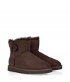 A stylish twist on a venerable classic, the Ugg Australia chocolate Mini Bailey Button boot is a welcome addition to your cold weather casual wardrobe - Crafted from twin-faced sheepskin and featuring exposed seams, reinforced heel, traction outsole and signature Ugg label - Wooden button and elastic band closure - Fleece-lined for superior warmth and comfort - Newer, ankle-length height - Truly versatile, perfect for pairing with everything from skinny jeans to yoga pants to miniskirts