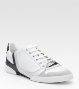 Sleek and sporty sneakers constructed in leather with patent and suede trim. Padded insole Rubber sole Made in Italy 