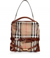 Detailed in the house check with dark tan leather trim, Burberry Londons canvas hobo is an iconic multi-season must for timeless-classic looks - Leather hobo strap, removable belted shoulder strap, wrap-around leather belted straps with engraved logo plaque, two internal sections with a zippered middle pocket, inside back wall zippered pocket, protective feet - Carry as a sophisticated compliment to polished daytime looks