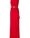 Show-stopping evening gown of red silk - Features feminine, side draping, decorative crystals at waist belt, transparent back and shoulders - Slim cut flatters the figure with asymmetric, pleating - Refined and luxurious with sexy silver sandals and a matching clutch