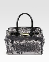 Channel old-Hollywood glamour in this sequined silk carryall finished with patent leather trim.Double top handles, 5¼ dropMagnetic top closureProtective metal feetOne inside zip pocketOne inside leather open pocketSatin lining11W X 13¼H X 6DImported