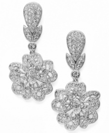 Evening gown...check. Clutch...check. Accessories...check! Take your special occasion to a whole new level with Eliot Danori's dazzling Plumeria earrings. Sparkling round-cut crystals decorate a teardrop and flower shape set in silver tone mixed metal. Approximate drop: 1-1/2 inches.