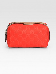 Nylon Guccissima trimmed with leather in a petite zip-top case.Top zip closureFully lined6¼W X 3½H X 3½DMade in Italy