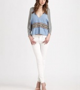 Airy cotton jersey and chambray in a draped dolman pullover accented with woven tribal-print trim.V necklineDropped shouldersDolman sleevesAbout 23 from shoulder to hemCottonDry cleanImportedModel shown is 5'10 (177cm) wearing US size Small.