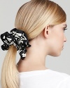 The scrunchie is back in high fashion from MARC BY MARC JACOBS, with a bold, logo print. Make a statement with your pony.