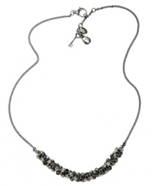 Simple yet stunning. A sparkling row of black crystals adorns this chic chain necklace from Fossil. Crafted in ruthenium tone mixed metal, it includes a lobster claw closure. Approximate length: 18 inches + 2-inch extender.