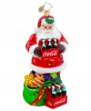 Santa Claus pops open the perfect gift – two six packs of Coca-Cola for delicious and refreshing holidays. With brilliant detail, from the holly in his hat to the bells on his bag, it's an essential ornament for Christopher Radko collectors.