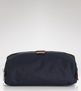 Jack Spade offers up a minimalist dopp kit with a zip top, leather details and interior zip compartments to store all of your travel toiletries.