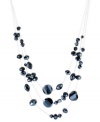 Rows of resplendent beads dazzle on this illusion necklace from Kenneth Cole New York. It's crafted from silver-tone mixed metal with navy faceted cherry and circle beads for a stunning effect. Approximate length: 17 inches + 3-inch extender. Approximate drop: 2 inches.