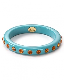 Studded with orange rhinestones, Juicy Couture's enamel bangle is a bright bet. Stacked or solo, this style makes a spectrum of looks pop.