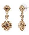 Go for the gold! Crafted in gold tone mixed metal, Monet's drop earrings dazzle with rich golden brown topaz-colored glass accents in a feminine floral pattern. Approximate drop: 1-3/8 inches.