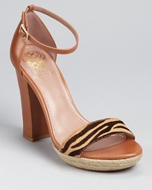 A summer shoe impossible to resist--Vince Camuto's Venize sandals boast the season's block heel trend, made extra covetable with the addition of zebra print and jute details.