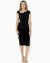 A timeless sheath dress in figure-flattering matte jersey is modernized in a cap-sleeved silhouette with elegant draping at the hip.