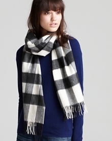 Black and white and Burberry all over, this boldly elegant cashmere scarf works well with neutrals and colors alike.