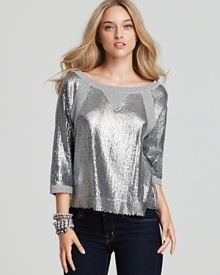 Uptown shine adorns a downtown silhouette in this chic Plenty by Tracy Reese sequined sweatshirt. Rock the look with a luxurious leather skirt and patent pumps.